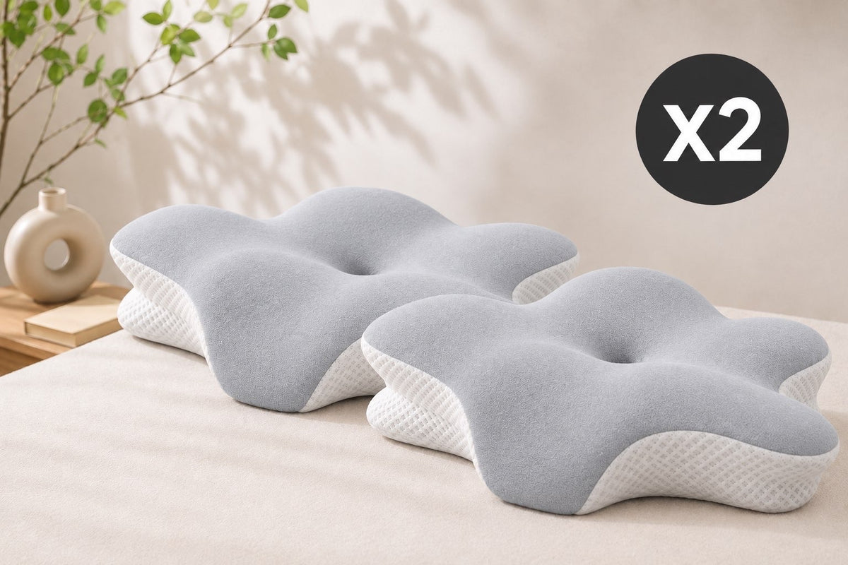 Deux oreillers ergonomiques côte à côte sur un lit double